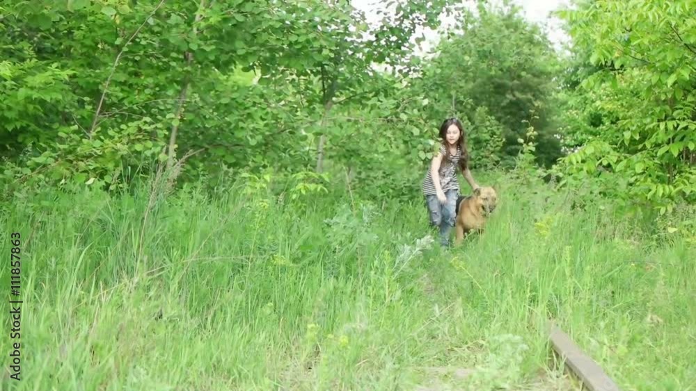 little girl running with German Shepherd, slow motion little girl running with German Shepherd, slow motion