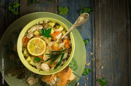 Bowl of chicken soup on a table
