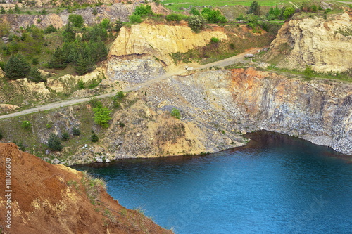 blue lake in old abandoned quarry © taviphoto