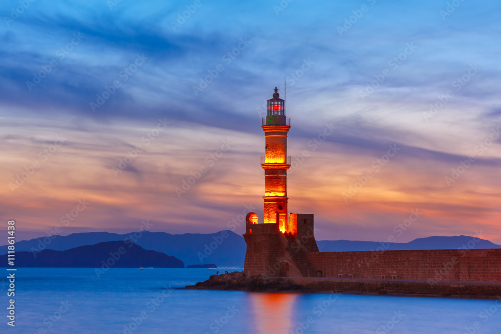 Lighthouse in old harbour of Chania at sunset, Crete, Greece