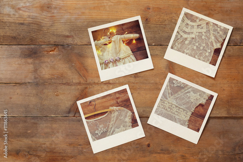 top view of instant photos album on wooden background