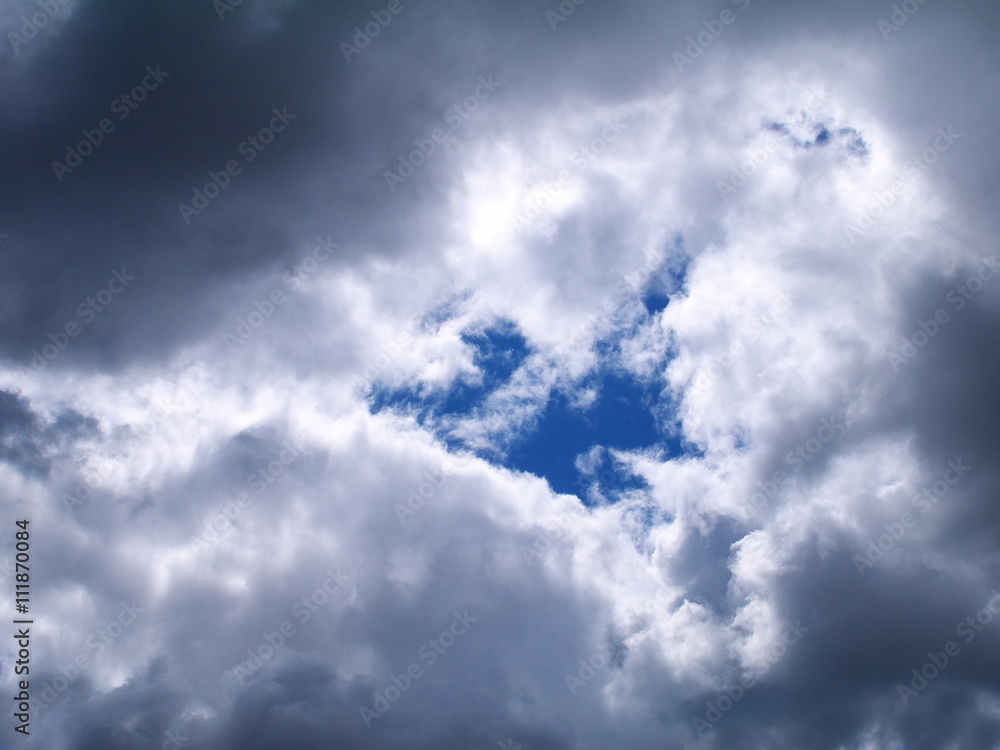 Fototapeta premium the gap in the dark gray clouds