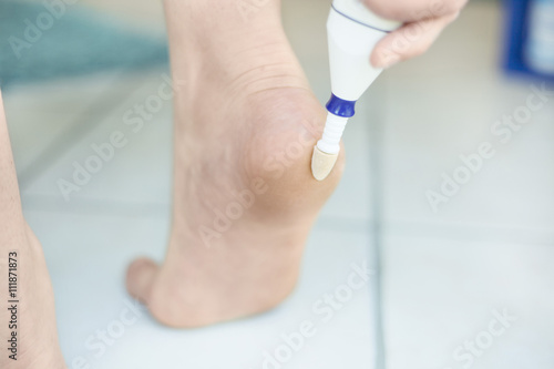 Electric foot scrubber being used in pedicure