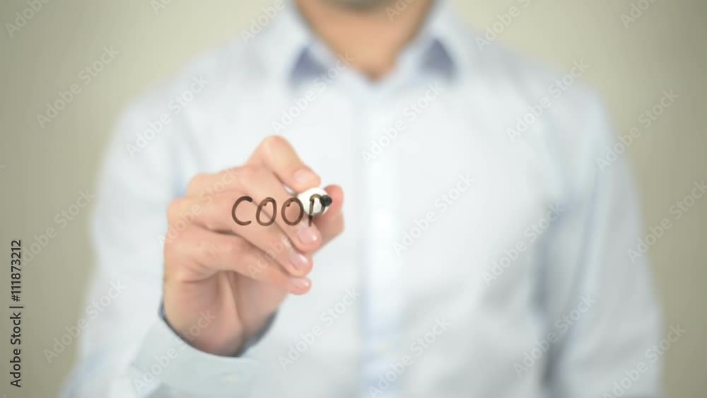 Cooperation , man writing on transparent wall Cooperation , man writing on transparent wall