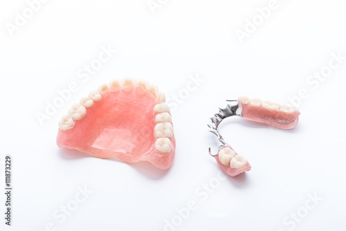 Set of dentures on white background