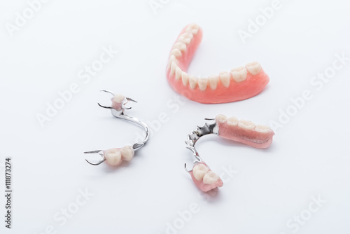Set of dentures on white background