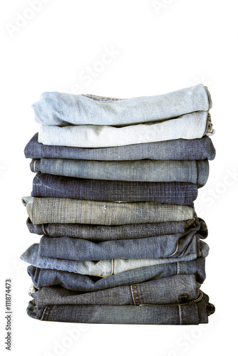 Lot of different jeans isolate on white background