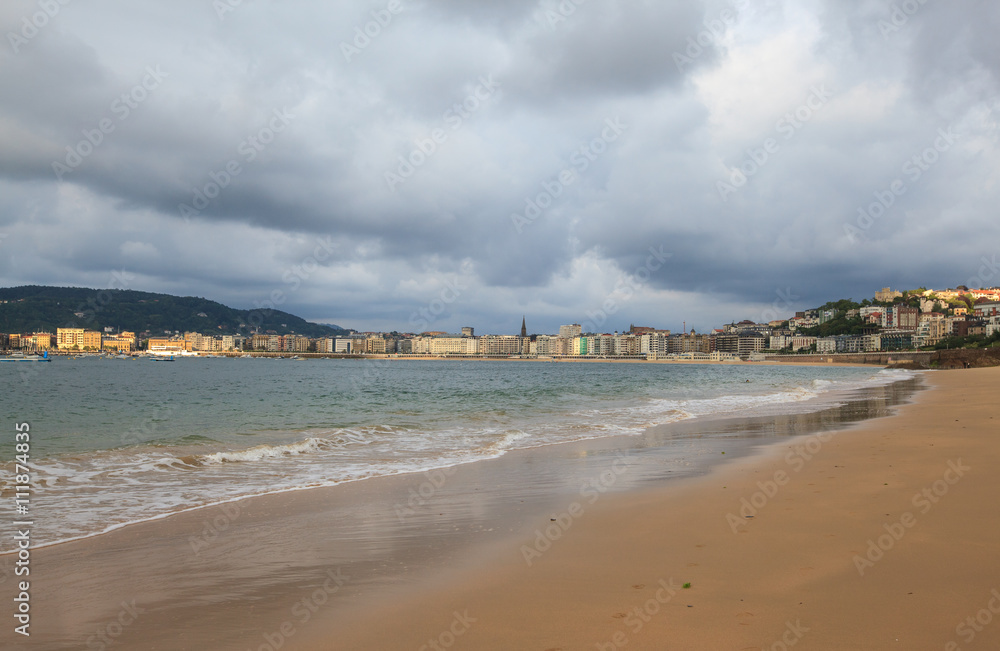 View of La Concha beach and city of San Sebastian in cloudy day, Basque Country, Spain
View of La Concha beach and city of San Sebastian in cloudy day, Basque Country, Spain