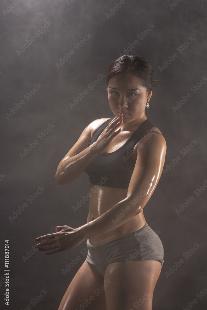 Obraz premium Strong and beautiful. Studio shot of a gorgeous sporty boxer woman