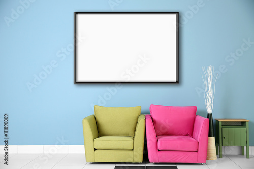 Two armchairs and empty pic...