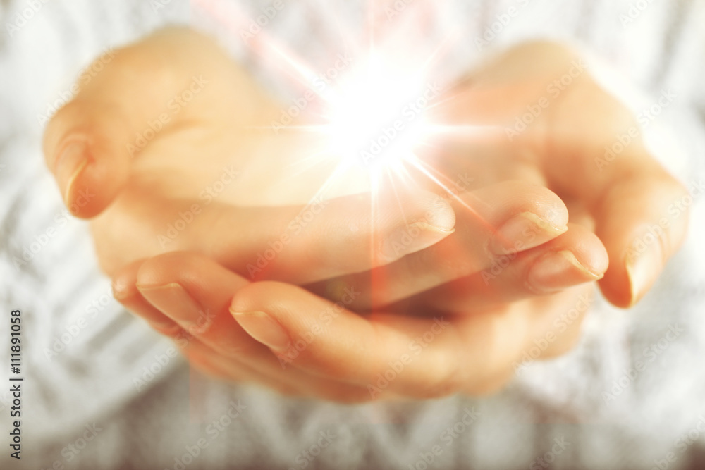 Light in hands. Concept of taking, care, protection Light in hands. Concept of taking, care, protection
