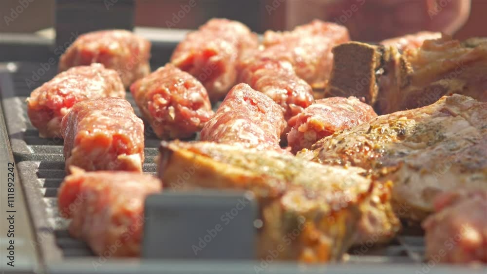 Traditional Romanian Barbecue With Pork Meat Rolls (Mici Or Mititei) And Stakes Traditional Romanian Barbecue With Pork Meat Rolls (Mici Or Mititei) And Stakes