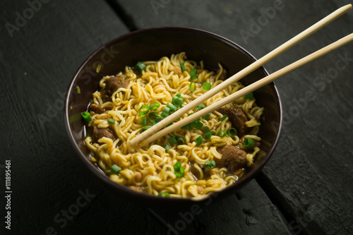 Fotografija Asian quick noodles on wood background photo