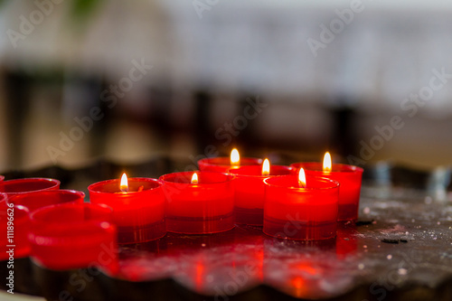 Cross of votive candles