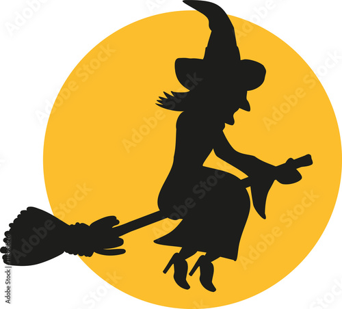 Flying witch silhouette at night in front of the moon