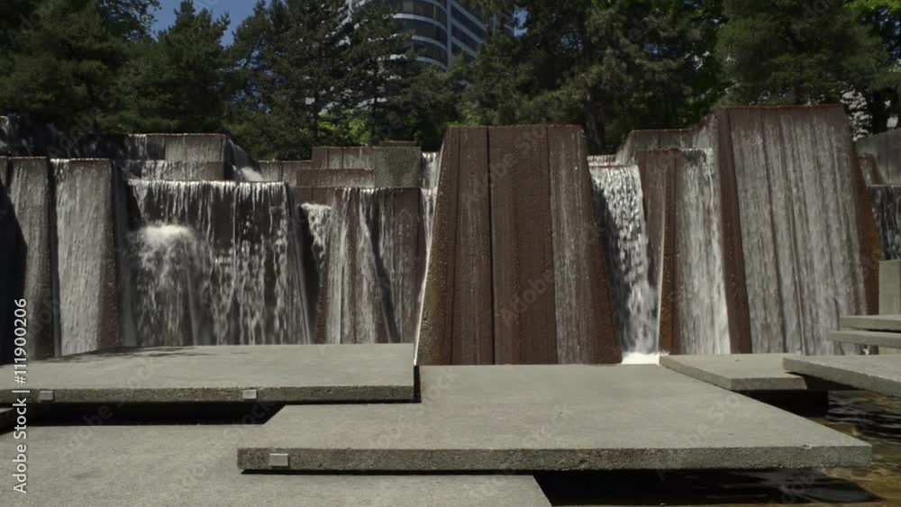 Keller fountain in Portland, Oregon. Camera tilts down to the signage under water reading: Ira's Fountain Dedicated By Portland to Ira C. Keller, Keller fountain in Portland, Oregon. Camera tilts down to the signage under water reading: Ira's Fountain Dedicated By Portland to Ira C. Keller,