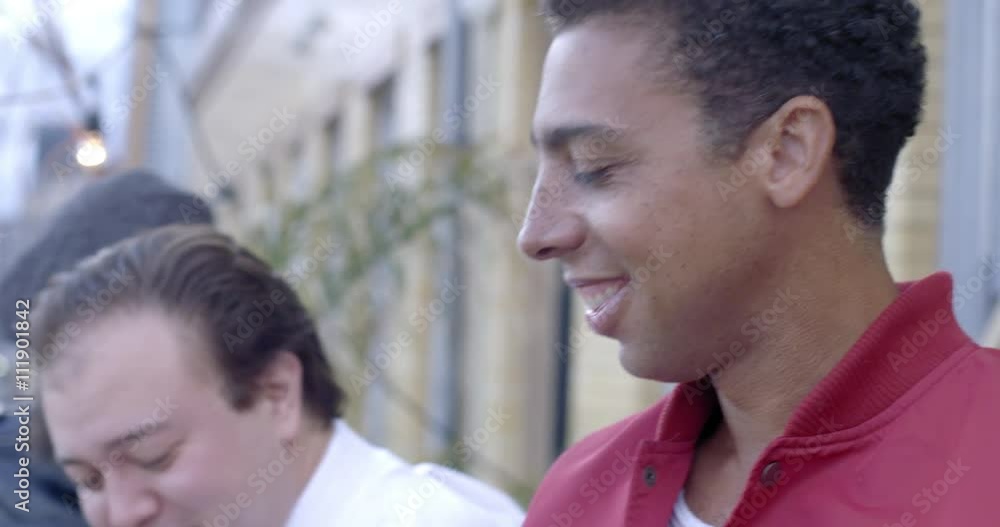 Young man with dark skin at an open-air party in Downtown Los Angeles, Camera follows as he looks around then drinks beer. Close up, recorded in slow motion at 60fps. Young man with dark skin at an open-air party in Downtown Los Angeles, Camera follows as he looks around then drinks beer. Close up, recorded in slow motion at 60fps.