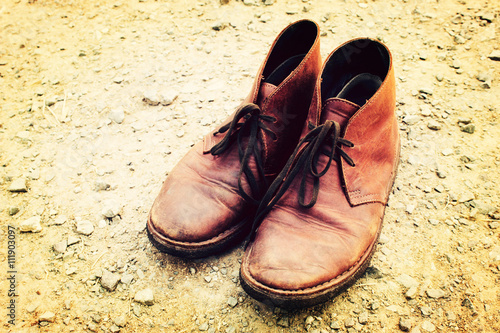 Vintage tone: Leather Shoe on dirt road