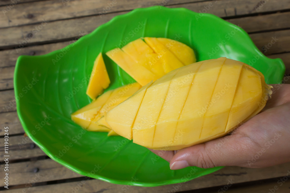 peel mango: mango in hand
