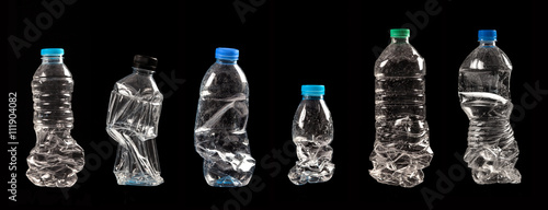 variety of compressed plastic bottles isolated on black background