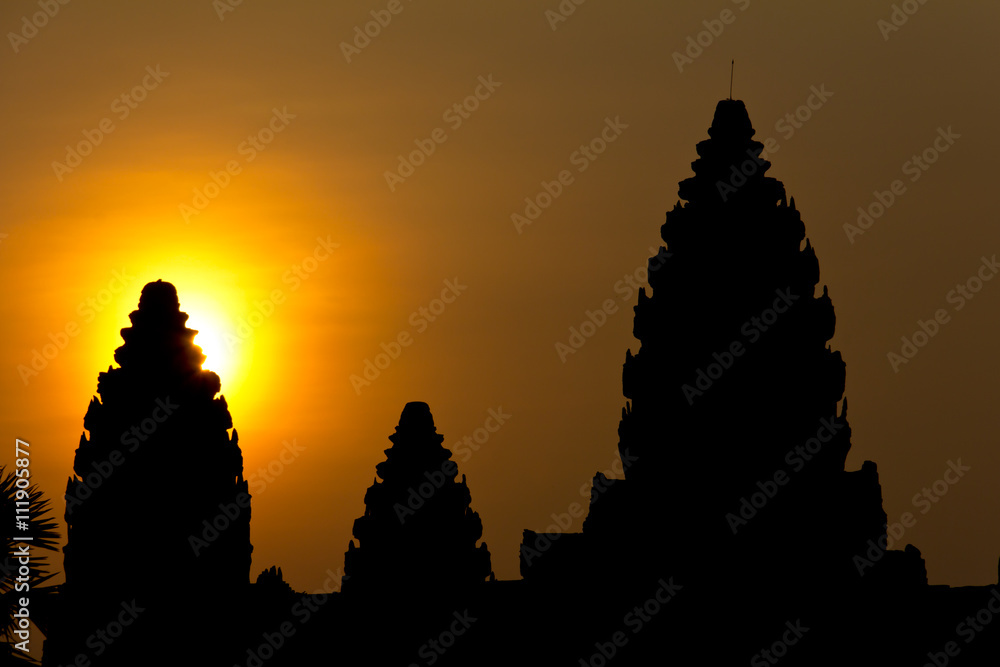 Spires of Angkor Wat backlit by sun