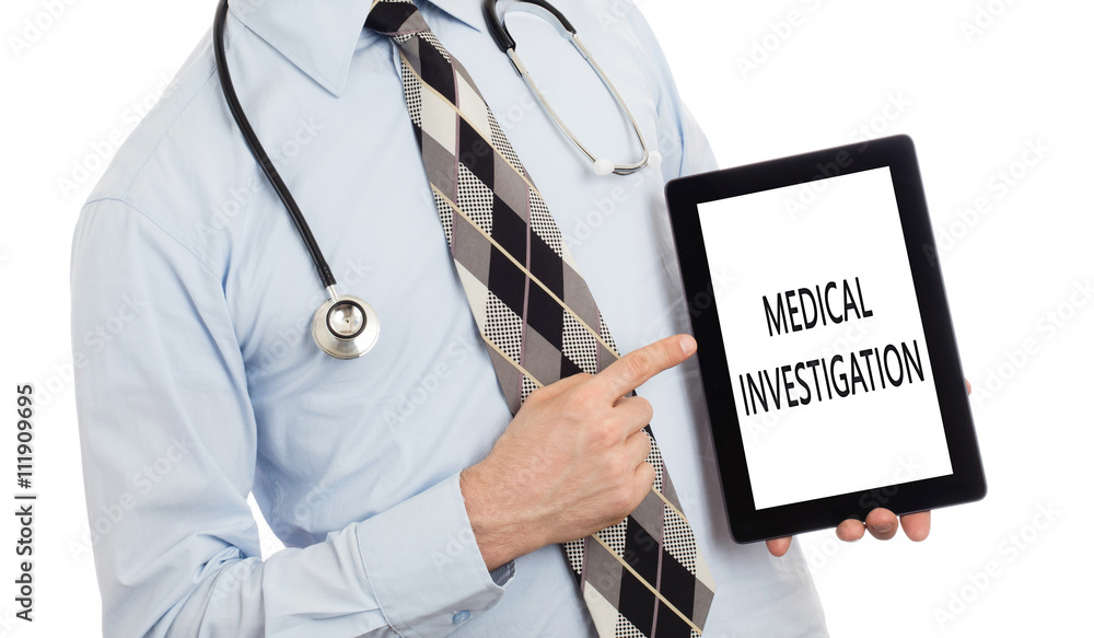 Doctor holding tablet - Medical investigation Doctor holding tablet - Medical investigation