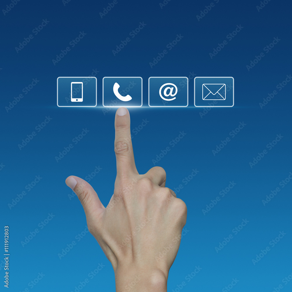 Hand pressing telephone, mobile phone, at and email buttons over Hand pressing telephone, mobile phone, at and email buttons over