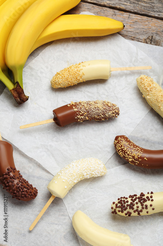 Banana covered in chocolate on a pergament