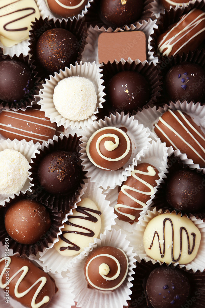 Chocolates on grey wooden background Chocolates on grey wooden background