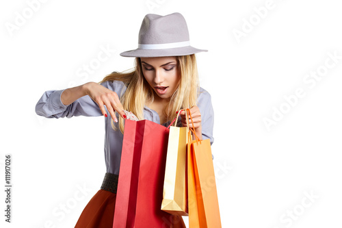 Smiling woman hold shopping bag.