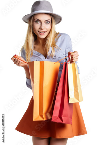 Smiling woman hold shopping bag.