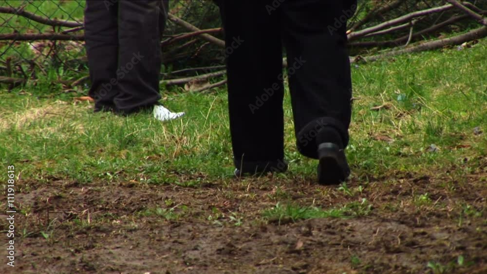 Focus on the legs walking over a muddy ground
Focus on the legs walking over a muddy ground