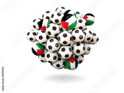Pile of footballs with flag of palestinian territory