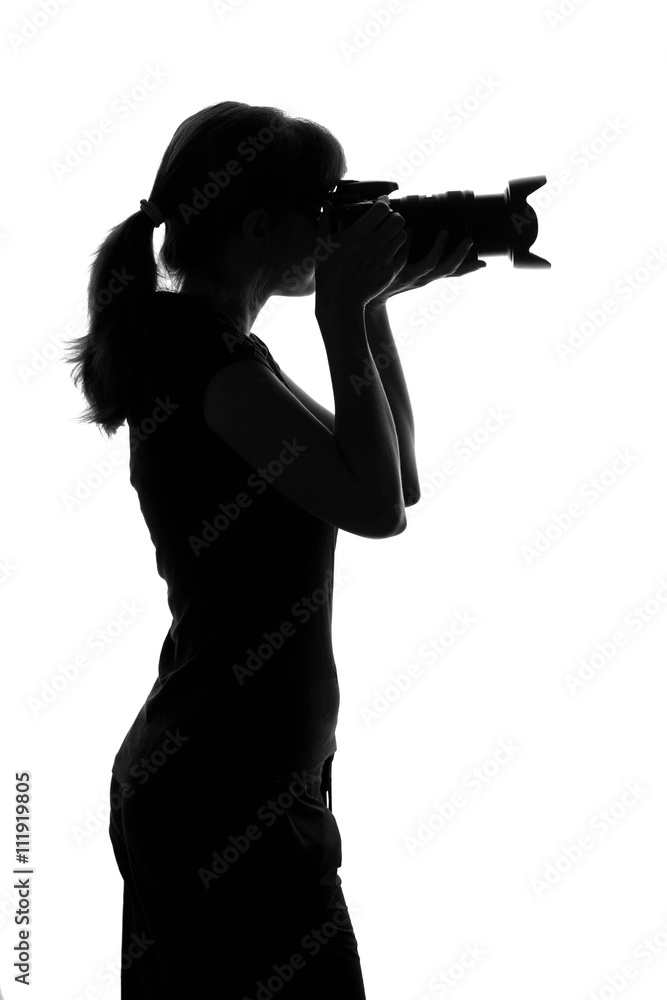 woman takes a photo by camera