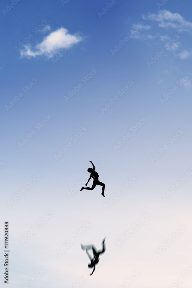 Satisfied woman jumping on the sky Satisfied woman jumping on the sky