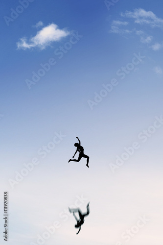 Satisfied woman jumping on the sky