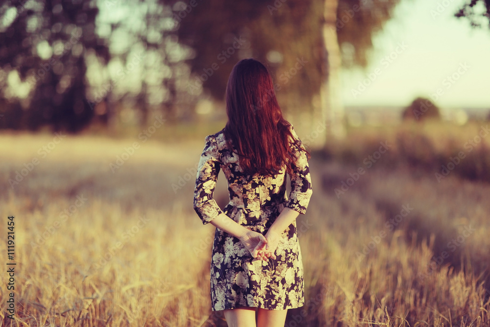 Girl in dress on the summer road Girl in dress on the summer road