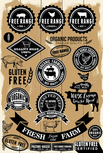 A collection of free range and organic labels on wooden background 