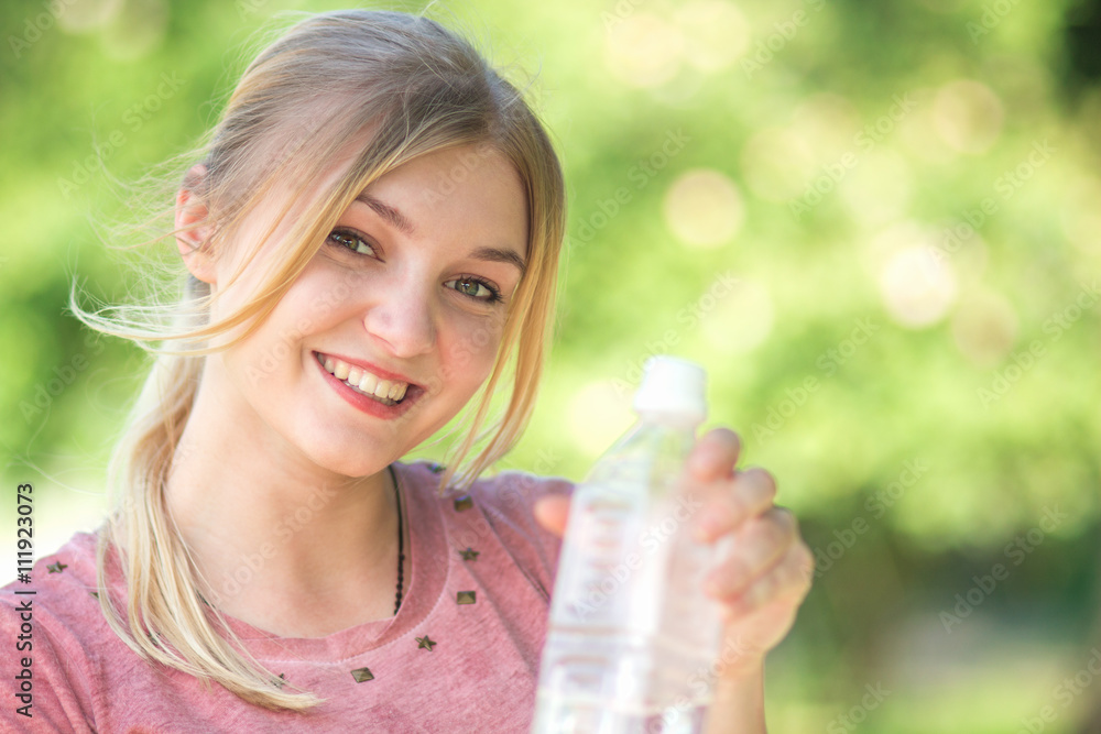 portrait of a woman with a bottle of clean water portrait of a woman with a bottle of clean water