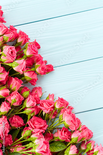 Roses on wooden background
