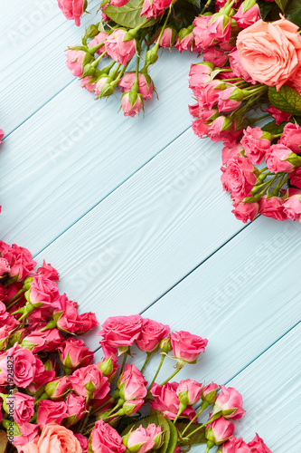 Roses on wooden background