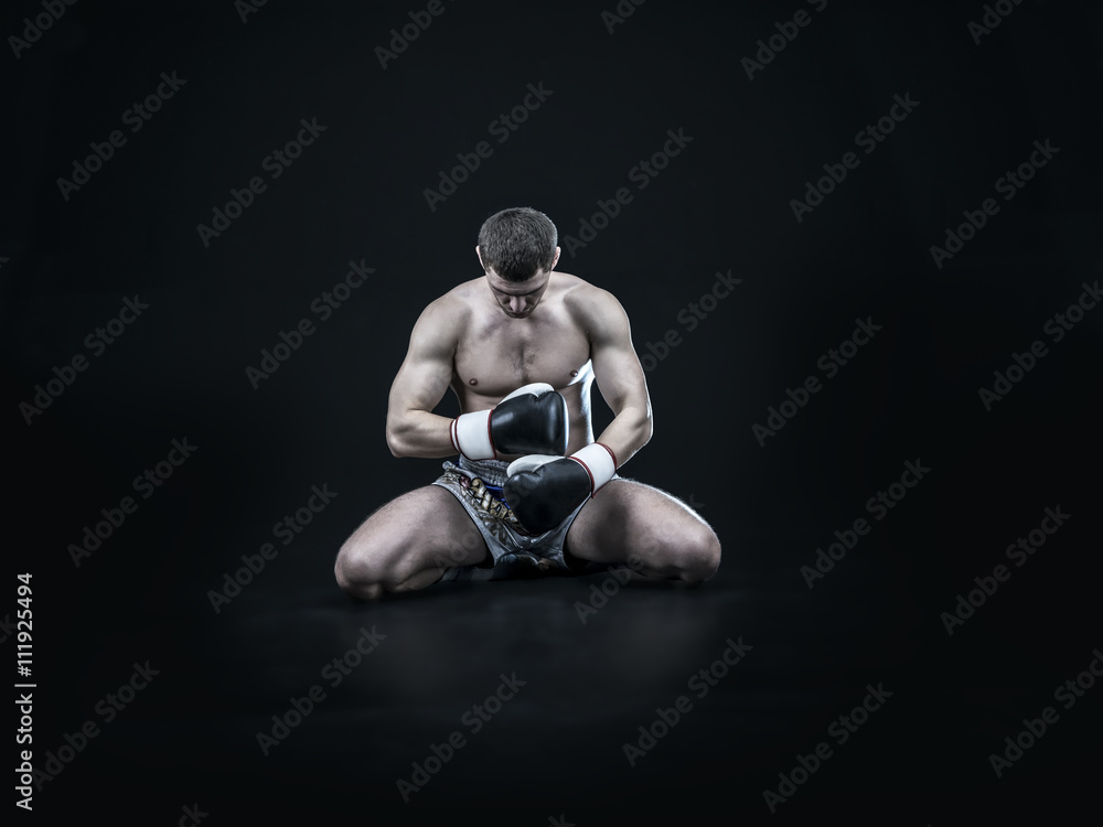 Muay thai fighter isolated on black background Muay thai fighter isolated on black background