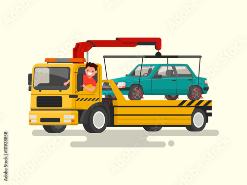 Friendly driver behind the wheel of a tow truck. Assistance 
