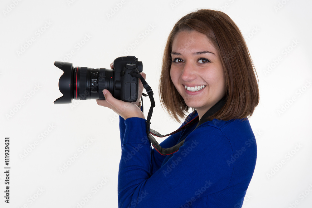 Smiling Female Photographer Shooting isolated on white Smiling Female Photographer Shooting isolated on white