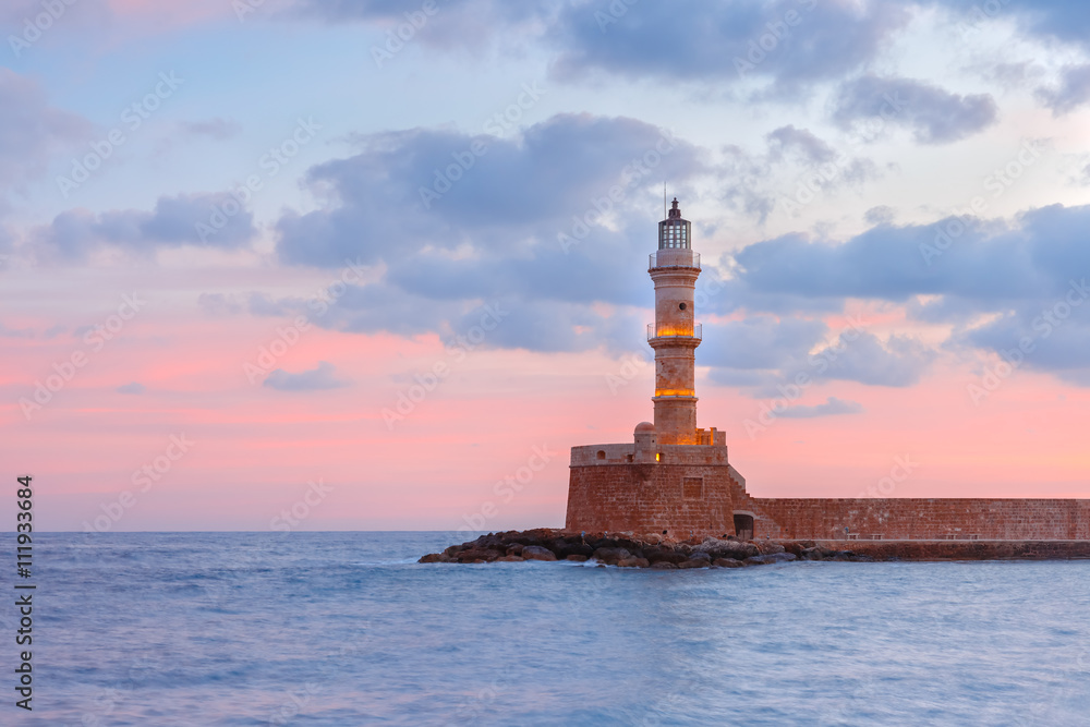Lighthouse in old harbour of Chania at dawn, Crete, Greece