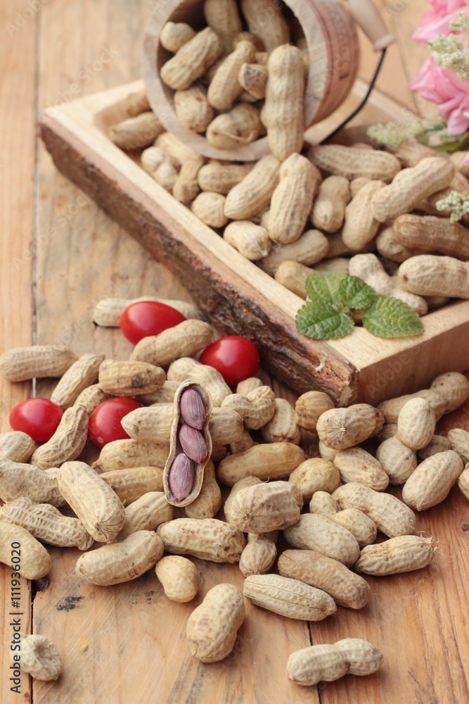 Peanut and boiled peanuts on wood background. Peanut and boiled peanuts on wood background.