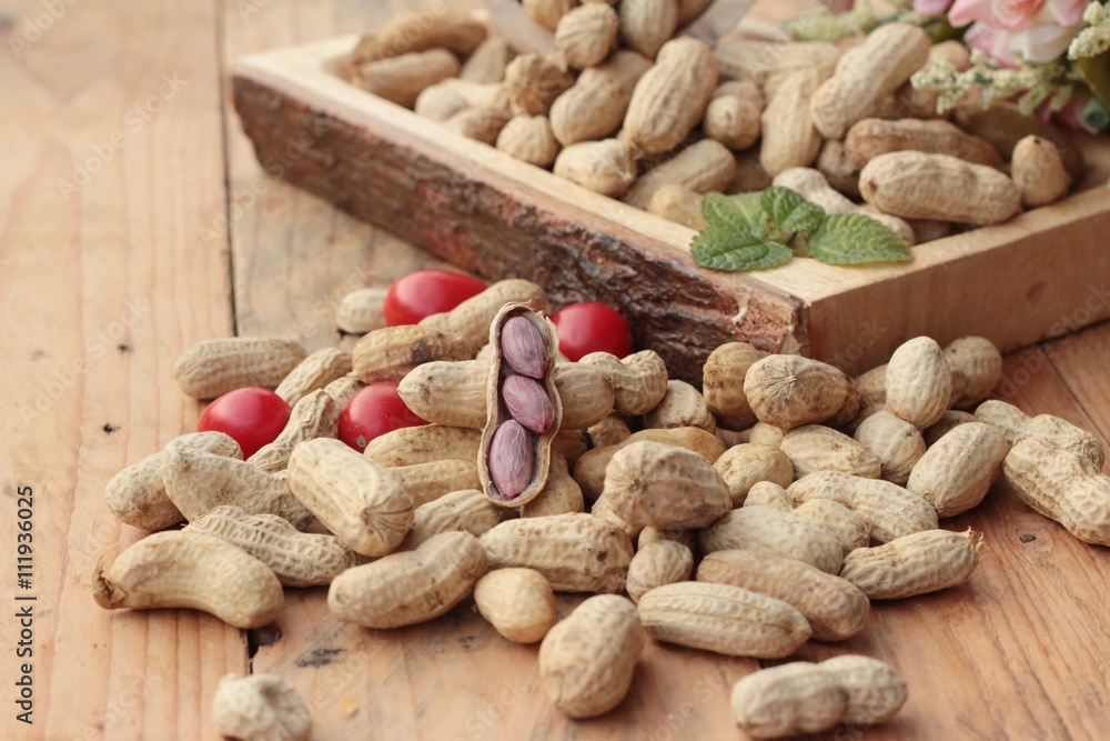 Peanut and boiled peanuts on wood background. Peanut and boiled peanuts on wood background.