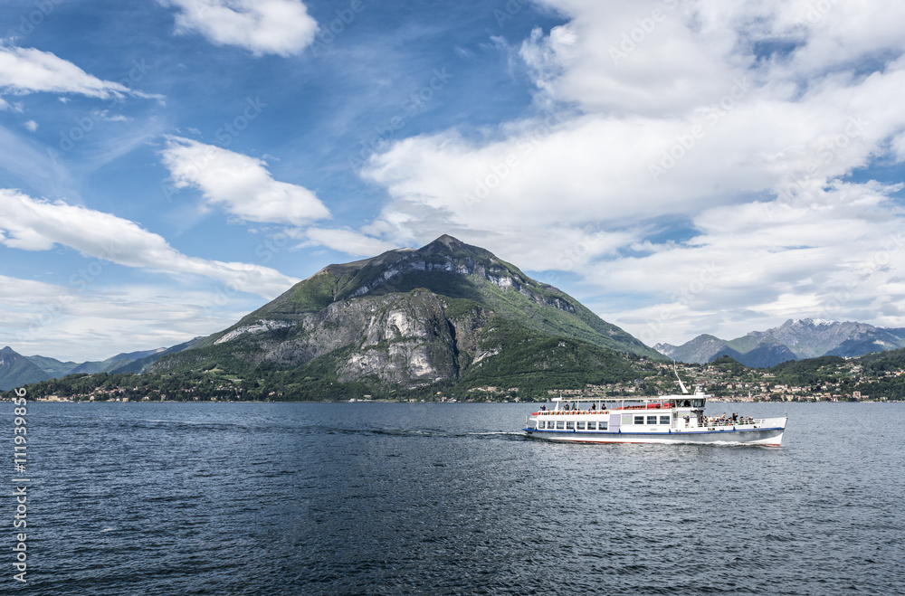 Lake Como Ferry: A public ferry boat passing Menaggio on its way to Varenna on Lake Como, Italy