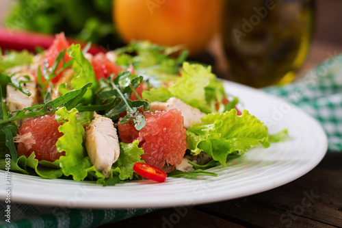 Fresh chicken salad, grapefruit, lettuce and honey mustard dressing. Dietary menu. Proper nutrition.