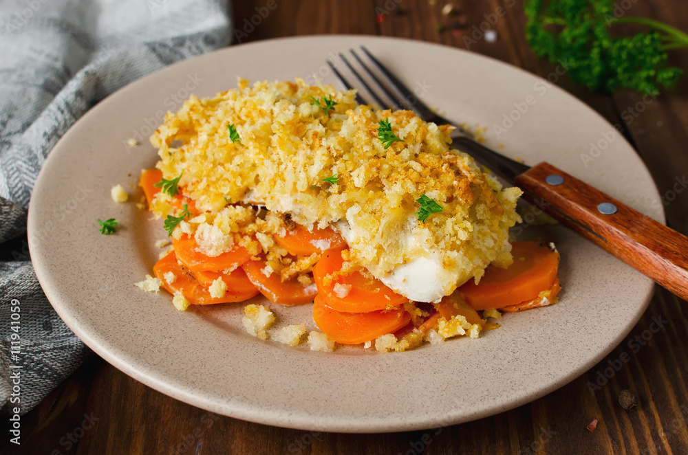 Oven-roasted fish fillet with carrots under a bread crust Oven-roasted fish fillet with carrots under a bread crust